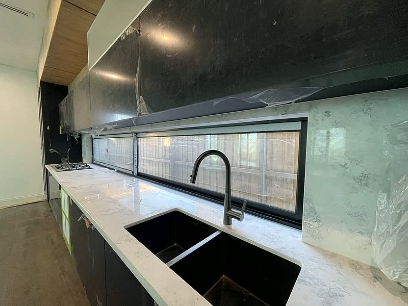 Dark Stone Galley Kitchen — renovation by TIJ Australia